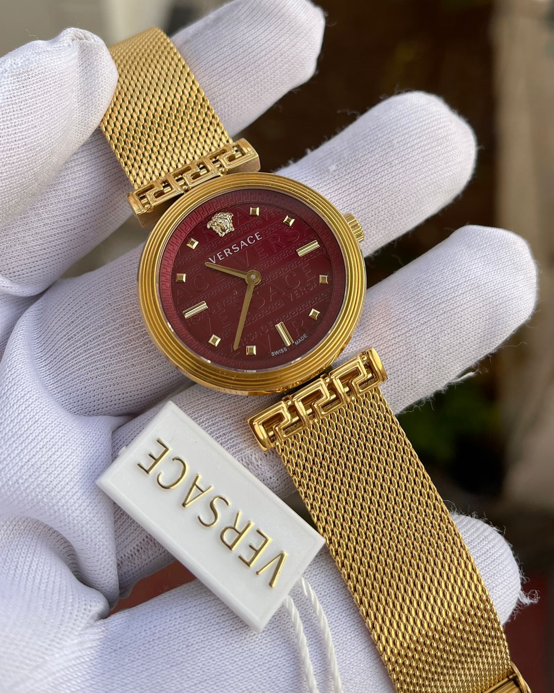Versace Gold Kasa Bordo Kadran Gold Hasır Kordon Bayan Kol Saati L-801